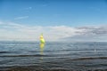 Sailing boat in sea of Gdansk, Poland. Sailboat with bright sail sailing on water on blue sky. Summer adventure and Royalty Free Stock Photo