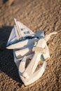 Sailing boat and seashell sand decoration closeup Royalty Free Stock Photo