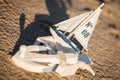 Sailing boat and seashell sand decoration closeup Royalty Free Stock Photo