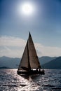 Yacht silhouette in the high sea on sunset Royalty Free Stock Photo