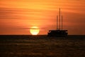 Sailing boat silhouetted at sunset