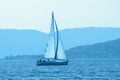 Sailing boat on water. Montenegro. Blue toned image