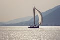 Sailing boat on water, silhouettes. Montenegro, Bay of Kotor Royalty Free Stock Photo