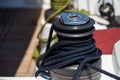 Sailing boat winch component detail with drag rope in Greece Royalty Free Stock Photo