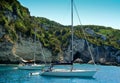 Sailing boats anchored near cliffs Royalty Free Stock Photo