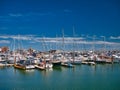 Sailing boats berthed at Ramsgate Marina in Kent, UK. Taken on a calm sunny day in summer with a blue sky Royalty Free Stock Photo