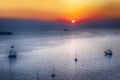 Sailing Boats and Cruise Ships Near Santorini Island at Dusk Royalty Free Stock Photo