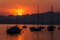 Sailing Boats on lake Garda with sunset, Italy Royalty Free Stock Photo