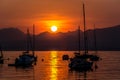 Sailing Boats on lake Garda with sunset, Italy Royalty Free Stock Photo