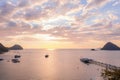 Sailing boats and marina of Labuan Bajo coast and a marina with pink sky background during sunset Royalty Free Stock Photo