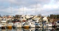 Sailing boats in marine. Yachts and motor boats at the pier. Sailing vessels anchored in a harbor. Royalty Free Stock Photo