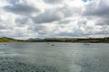 Sailing boats moored in the bay of Inishbofin Island, calm waters of the Atlantic Ocean