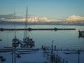 Sailing boats moored at Harstad, Norway, with snow capped mountains Royalty Free Stock Photo