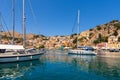 Sailing boats mooring in port of Symi island, Greece