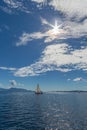 Sailing boats on natural water clouds blue sky sun Royalty Free Stock Photo