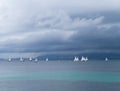 Sailing boats race on sea on a cloudy day Royalty Free Stock Photo