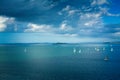 Sailing boats racing over calm waters of Auckland Harbour on a beautiful winter day. North Island, New Zealand Royalty Free Stock Photo
