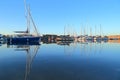 Sailing boats reflected on the water Royalty Free Stock Photo