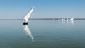 Sailing boats reflected in the water