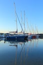 Sailing boats reflected on the water Royalty Free Stock Photo