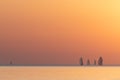 Sailing boats during sunset over a calm sea Royalty Free Stock Photo