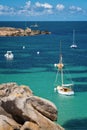 Sailing Boats and transparent water on Coz-Pors beach in Tregastel, CÃÂ´tes d`Armor, Brittany France Royalty Free Stock Photo