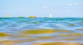 Sailing boats and waves seen by a swimmer at sea level, photography taken in VendÃ©e Royalty Free Stock Photo