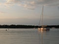 Sailing boats and yachts are floating on a peaceful surface of theAdriatic Sea,Croatia,Europe. In the background the coast with Me