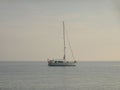 Sailing boats and yachts are floating on a peaceful surface of theAdriatic Sea,Croatia,Europe. In the background the coast with Me