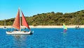 Sailing Catamaran with red sails at Second Beach, Great Keppel Island, Great Barrier Reef, Queensland