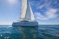 Sailing catamaran sail the Aegean sea Royalty Free Stock Photo