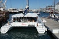 Sailing Catamaran Tigresse in Cape Town full of passenger ready for sunset cruise along beautiful coastline.