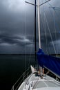 Sailing concept with boat and lake water storm weather Royalty Free Stock Photo