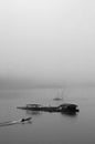 A sailor is sailing in foggy sea to fisherman village