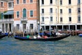 Sailing in the gondola people by Grand Canal in Venice