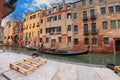 Sailing gondola in Venice near pier