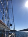 Sailing in Greece with Blue Skies and Mountains