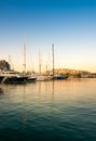 Sailing and luxury motor yachts in marina of Zeas. Sunset and v Royalty Free Stock Photo