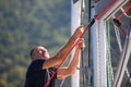 Sailing, man pulling ropes. Luxery yacht boat. Sport.