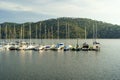 Sailing and motor boats moored at the docks of the San Juan reservoir in Madrid, sunset and an atmosphere of peace and tranquility Royalty Free Stock Photo