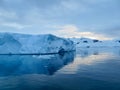 Iceberg reflections in calm waters of Lemaire Channel Antarctic Peninsula