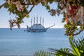 Sailing ship anchors in the port of Side in fine weather