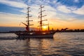 Sailing ship on the background of Peter and Paul fortress in the rays of the setting sun Royalty Free Stock Photo