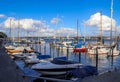 Sailing ship mast against the blue sky on some sailing boats with rigging details