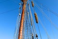 Sailing ship mast against the blue sky on some sailing boats with rigging details Royalty Free Stock Photo