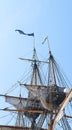 Sailing, ship and mast outdoor with flag for travel, journey and adventure by blue sky in summer. Boat, wood pole and Royalty Free Stock Photo