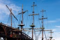 Sailing ship mast with rigging and cables against the sky. Royalty Free Stock Photo