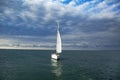 Sailing ship yachts with white sails at opened sea