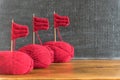 Sailing ships made from red yarn and knitting needles