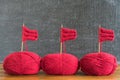 Sailing ships made from red yarn and knitting needles